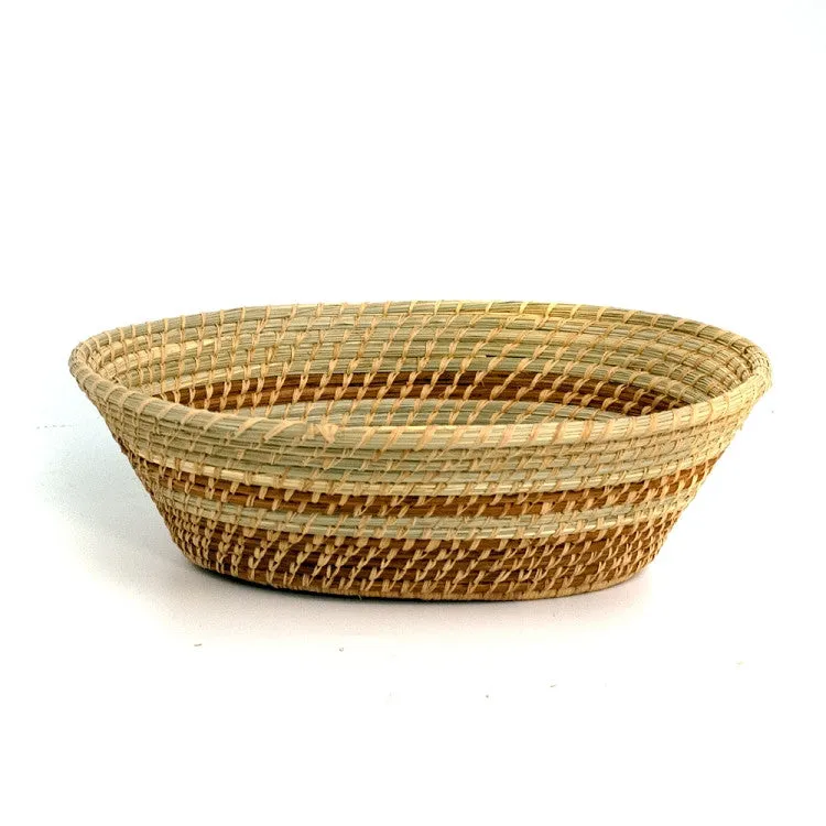 Oval pine needle basket with green wild grass